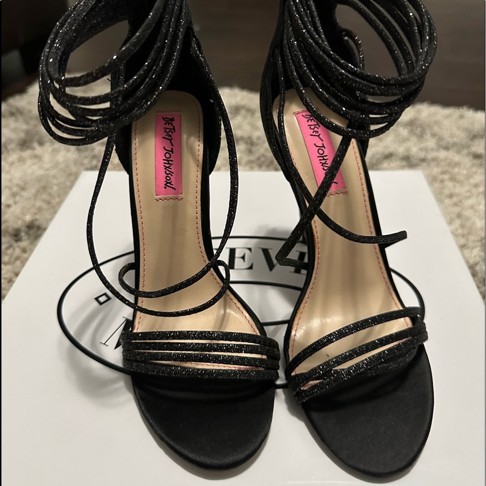 Beautiful black shine open toe heels. Very sophisticated and sexy.